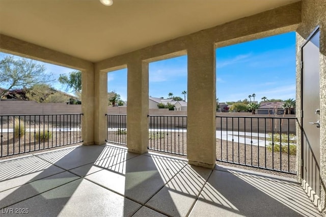 unfurnished sunroom featuring a residential view
