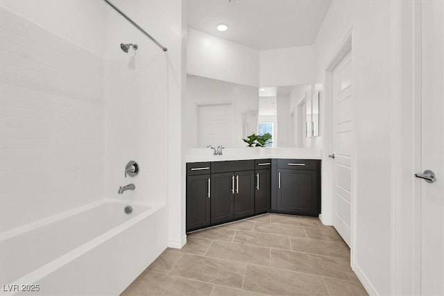 bathroom with tile patterned flooring, vanity, and tub / shower combination
