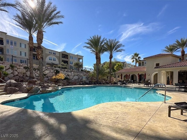 community pool featuring a patio area