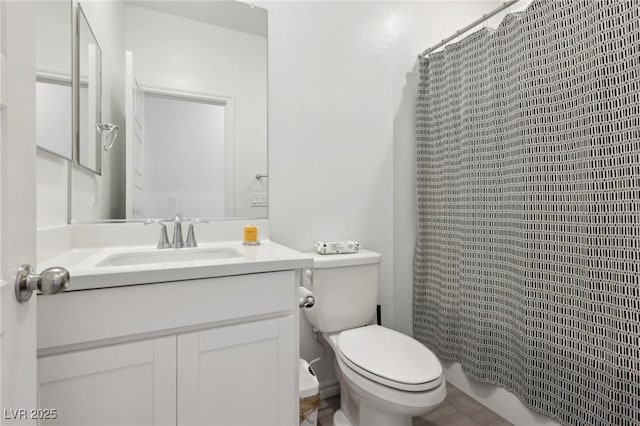 bathroom with toilet, curtained shower, and vanity