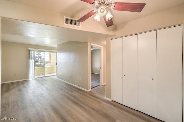 2120 Ramrod Ave Unit 2216, Henderson, NV 89014 - unfurnished bedroom featuring visible vents, light wood-style flooring, and baseboards