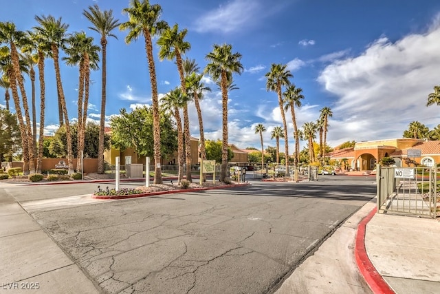 2120 Ramrod Ave Unit 2216, Henderson, NV 89014 - view of road featuring a gated entry, curbs, and a gate