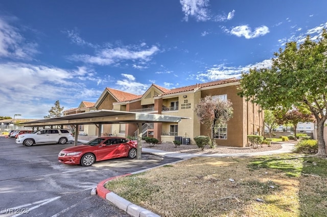2120 Ramrod Ave Unit 2216, Henderson, NV 89014 - exterior space with central AC unit and covered parking