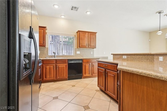 3029 Paseo Hills Way, Henderson, NV 89052 - kitchen with refrigerator with ice dispenser, black dishwasher, brown cabinets, a sink, and tasteful backsplash