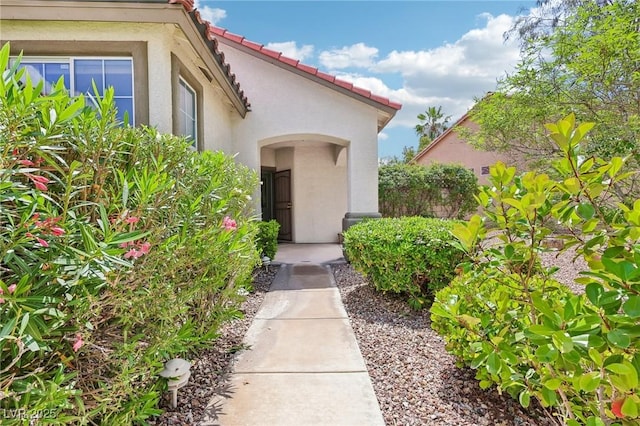 3029 Paseo Hills Way, Henderson, NV 89052 - doorway to property with stucco siding and a tiled roof