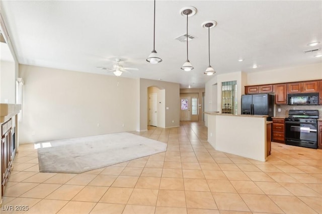 3029 Paseo Hills Way, Henderson, NV 89052 - kitchen with black appliances, open floor plan, arched walkways, a ceiling fan, and light tile patterned floors