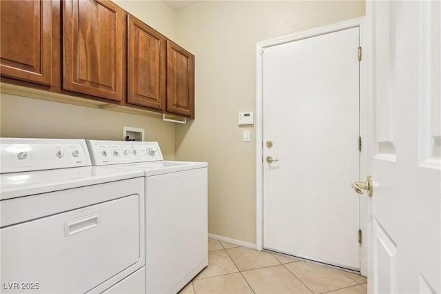 3029 Paseo Hills Way, Henderson, NV 89052 - washroom featuring separate washer and dryer, cabinet space, light tile patterned floors, and baseboards