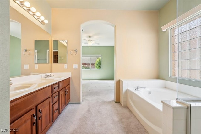 3029 Paseo Hills Way, Henderson, NV 89052 - bathroom with double vanity, a bath, and a ceiling fan