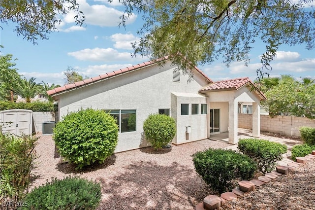 3029 Paseo Hills Way, Henderson, NV 89052 - back of house featuring a tiled roof, a patio area, and stucco siding
