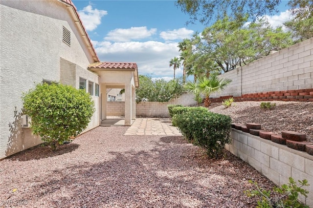 3029 Paseo Hills Way, Henderson, NV 89052 - fenced backyard with a patio