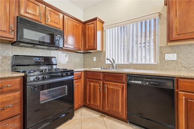 3029 Paseo Hills Way, Henderson, NV 89052 - kitchen featuring black appliances, a sink, brown cabinetry, and light countertops