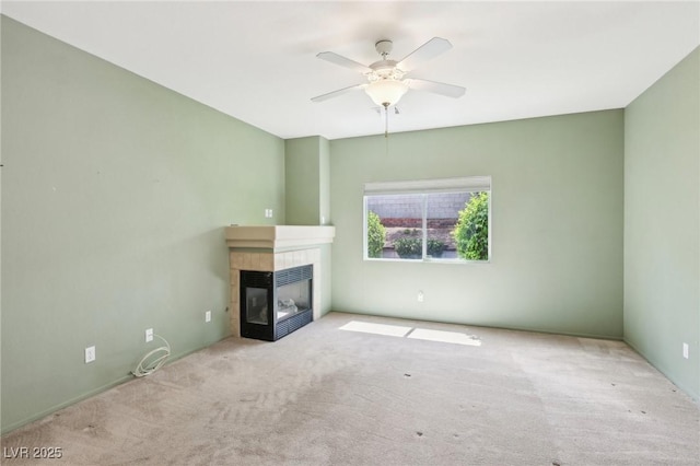 3029 Paseo Hills Way, Henderson, NV 89052 - unfurnished living room featuring carpet flooring, a tiled fireplace, and ceiling fan