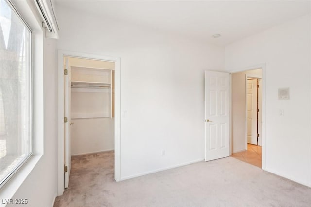 3029 Paseo Hills Way, Henderson, NV 89052 - unfurnished bedroom with light colored carpet, a walk in closet, and a closet