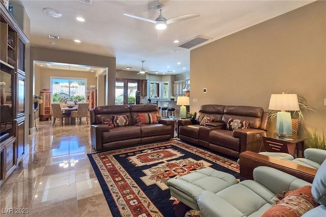 living room with a ceiling fan and recessed lighting