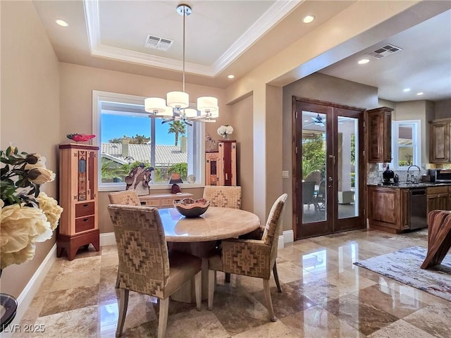 dining room with french doors, a chandelier, ornamental molding, baseboards, and recessed lighting