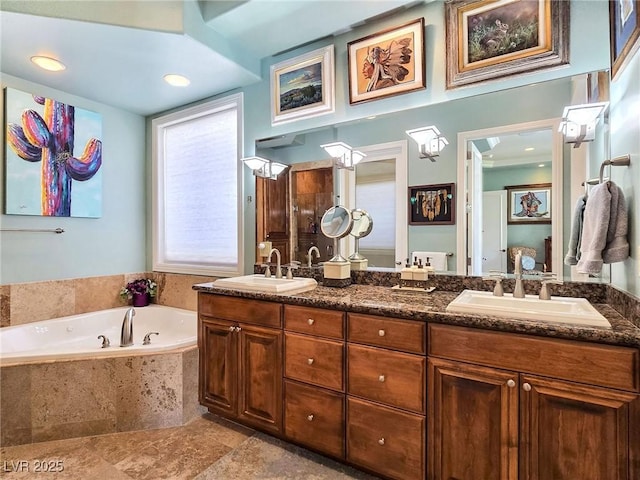 bathroom with a garden tub and double vanity