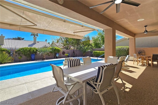 view of pool with outdoor dining area, ceiling fan, a fenced backyard, and a patio area