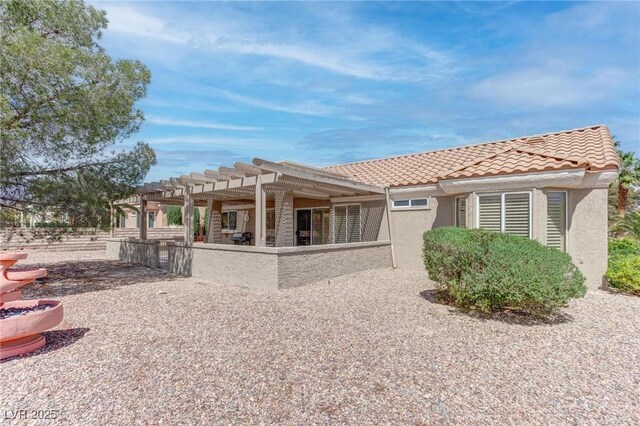 8801 Villa Ridge Dr, Las Vegas, NV 89134 - rear view of house featuring a patio, a tiled roof, a pergola, and stucco siding