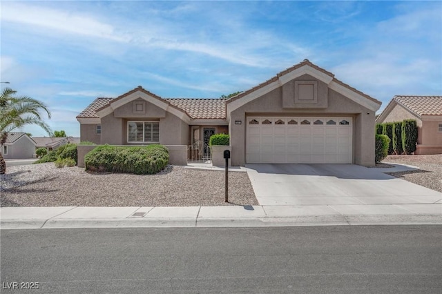 8801 Villa Ridge Dr, Las Vegas, NV 89134 - ranch-style house featuring concrete driveway, stucco siding, an attached garage, and a tile roof