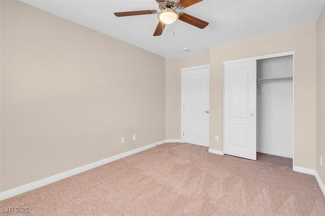 unfurnished bedroom featuring a closet, baseboards, a ceiling fan, and light carpet