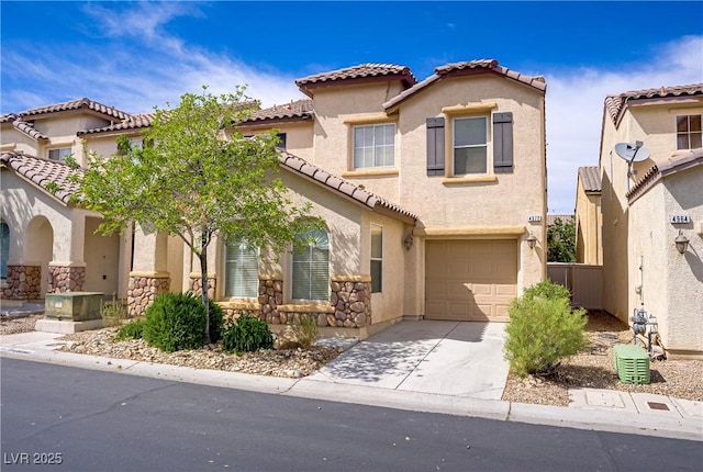 view of front of property with a garage, stucco siding, a tile roof, and concrete driveway