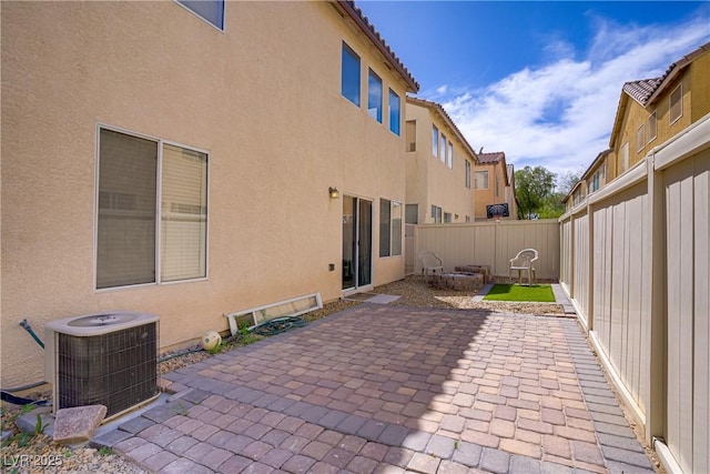 view of patio / terrace with a fenced backyard and central AC unit