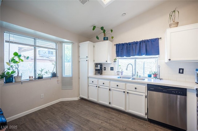 7103 Shadow Crest Dr, Las Vegas, NV 89119 - kitchen featuring dishwasher, a sink, lofted ceiling, tasteful backsplash, and white cabinets