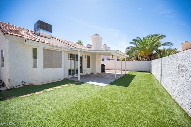 7103 Shadow Crest Dr, Las Vegas, NV 89119 - back of property featuring a tiled roof, a patio, a chimney, and stucco siding
