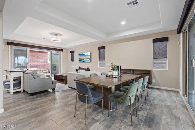342 Molinetto St, Las Vegas, NV 89138 - dining space with visible vents, baseboards, wood finished floors, and a raised ceiling