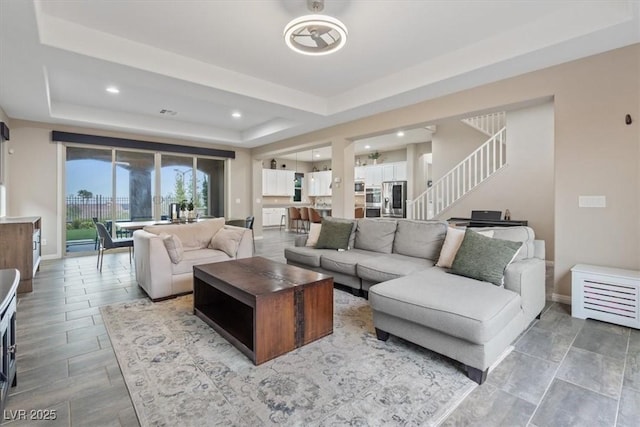 342 Molinetto St, Las Vegas, NV 89138 - living area with a tray ceiling, baseboards, recessed lighting, and stairs