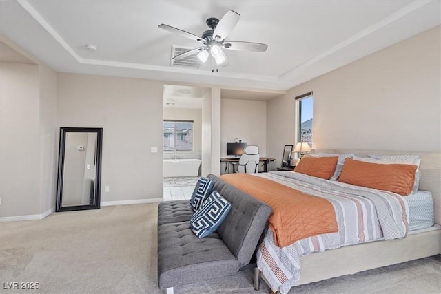 342 Molinetto St, Las Vegas, NV 89138 - bedroom with ensuite bathroom, baseboards, a raised ceiling, a ceiling fan, and light colored carpet