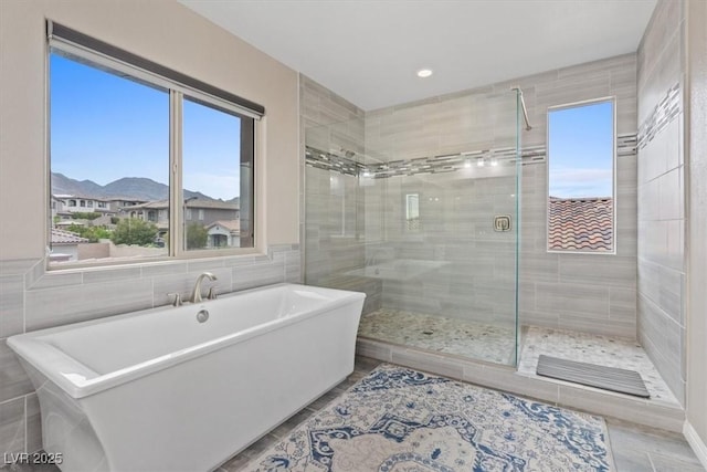 342 Molinetto St, Las Vegas, NV 89138 - bathroom with a stall shower, a freestanding tub, and tile walls