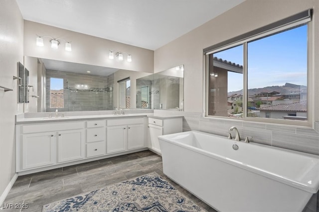 342 Molinetto St, Las Vegas, NV 89138 - full bath featuring a shower stall, double vanity, a freestanding bath, and a sink