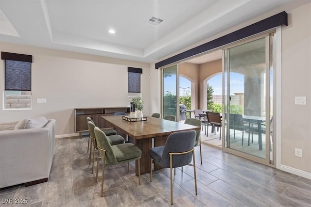 342 Molinetto St, Las Vegas, NV 89138 - dining room featuring a tray ceiling, visible vents, recessed lighting, wood finished floors, and baseboards