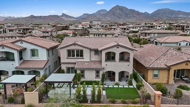 342 Molinetto St, Las Vegas, NV 89138 - view of front of house featuring a residential view, stucco siding, a fenced backyard, and a tile roof