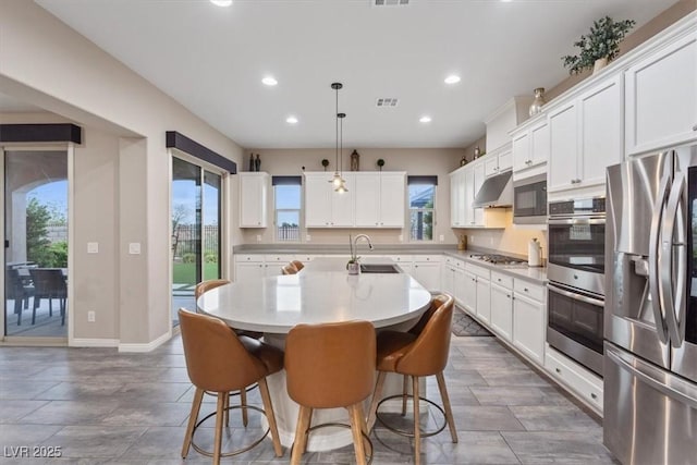 342 Molinetto St, Las Vegas, NV 89138 - kitchen featuring a sink, a kitchen island with sink, under cabinet range hood, recessed lighting, and stainless steel appliances