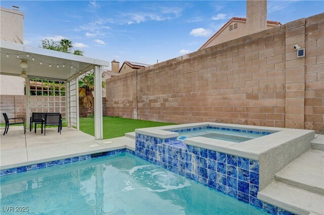 view of pool with a patio area, a fenced backyard, and an in ground hot tub