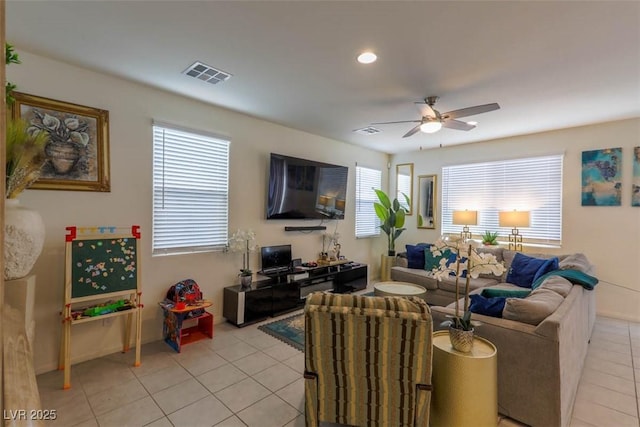 living room featuring recessed lighting, light tile patterned floors, visible vents, and a ceiling fan