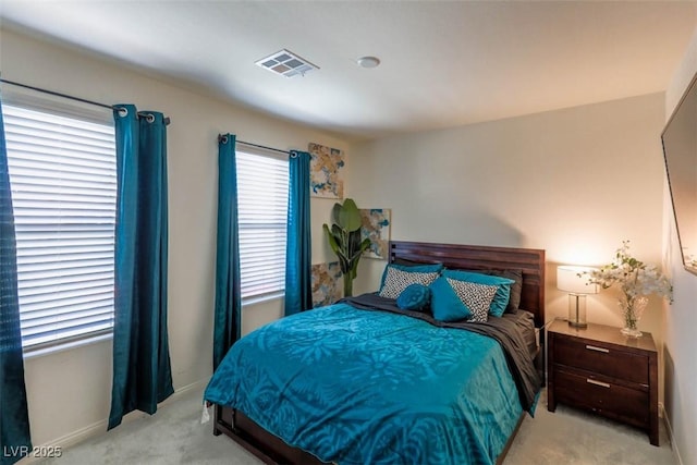 bedroom featuring baseboards, visible vents, and carpet floors