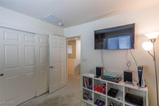 interior space with visible vents and a closet