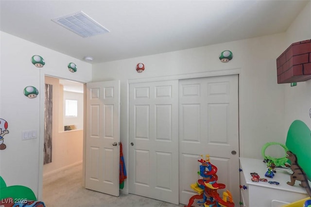 game room with visible vents and light colored carpet