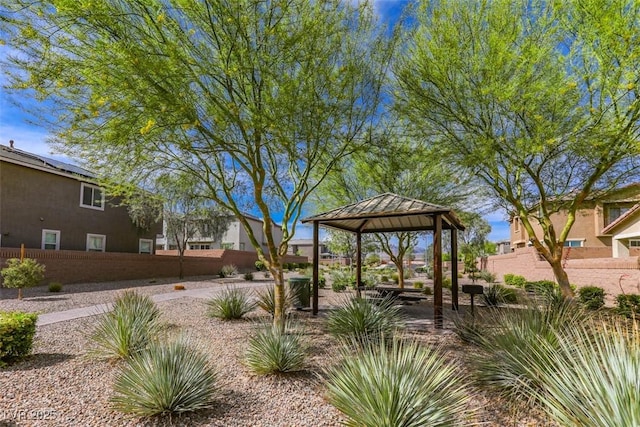 surrounding community with a gazebo and fence