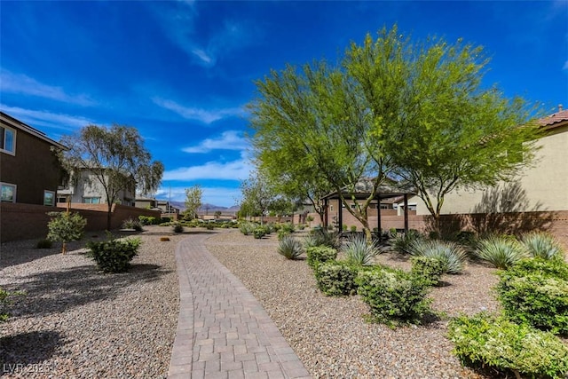 view of community featuring fence