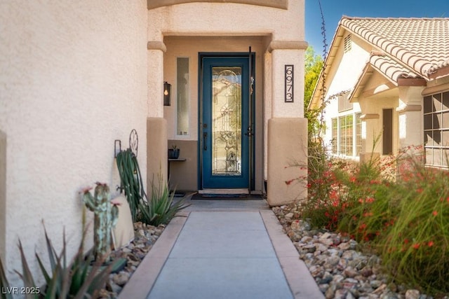 6973 Pacific Coast St, Las Vegas, NV 89148 - doorway to property featuring stucco siding
