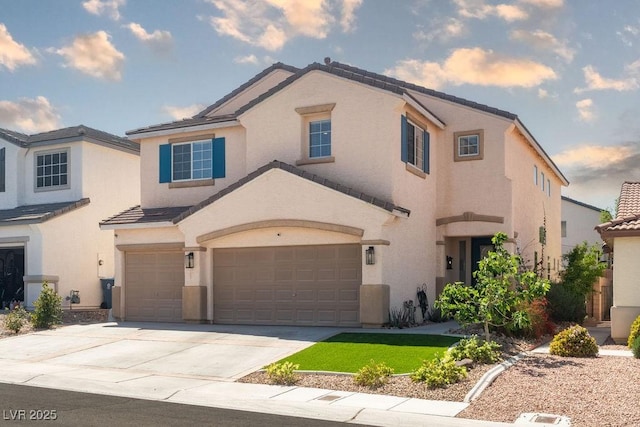 6973 Pacific Coast St, Las Vegas, NV 89148 - view of front of home with an attached garage, a tiled roof, concrete driveway, and stucco siding