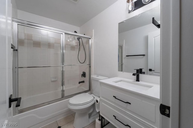 6973 Pacific Coast St, Las Vegas, NV 89148 - full bath featuring tile patterned flooring, toilet, vanity, and enclosed tub / shower combo