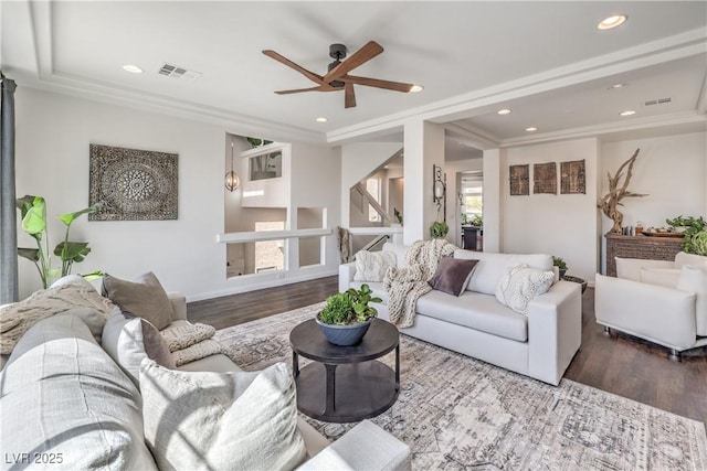 living area featuring wood finished floors, ceiling fan, visible vents, and recessed lighting