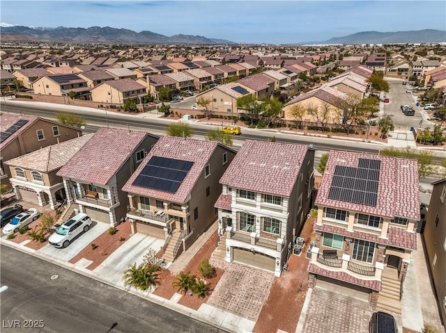 drone / aerial view with a mountain view and a residential view