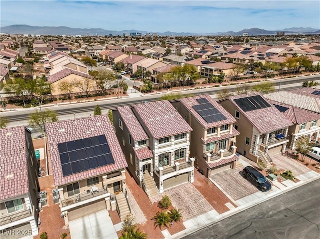 birds eye view of property with a mountain view and a residential view