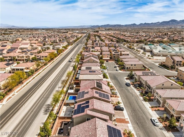 drone / aerial view featuring a residential view and a mountain view